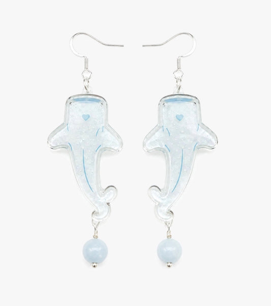 Translucent whale shark drop earrings with pearly texture, soft blue details, and pale blue bead drops.