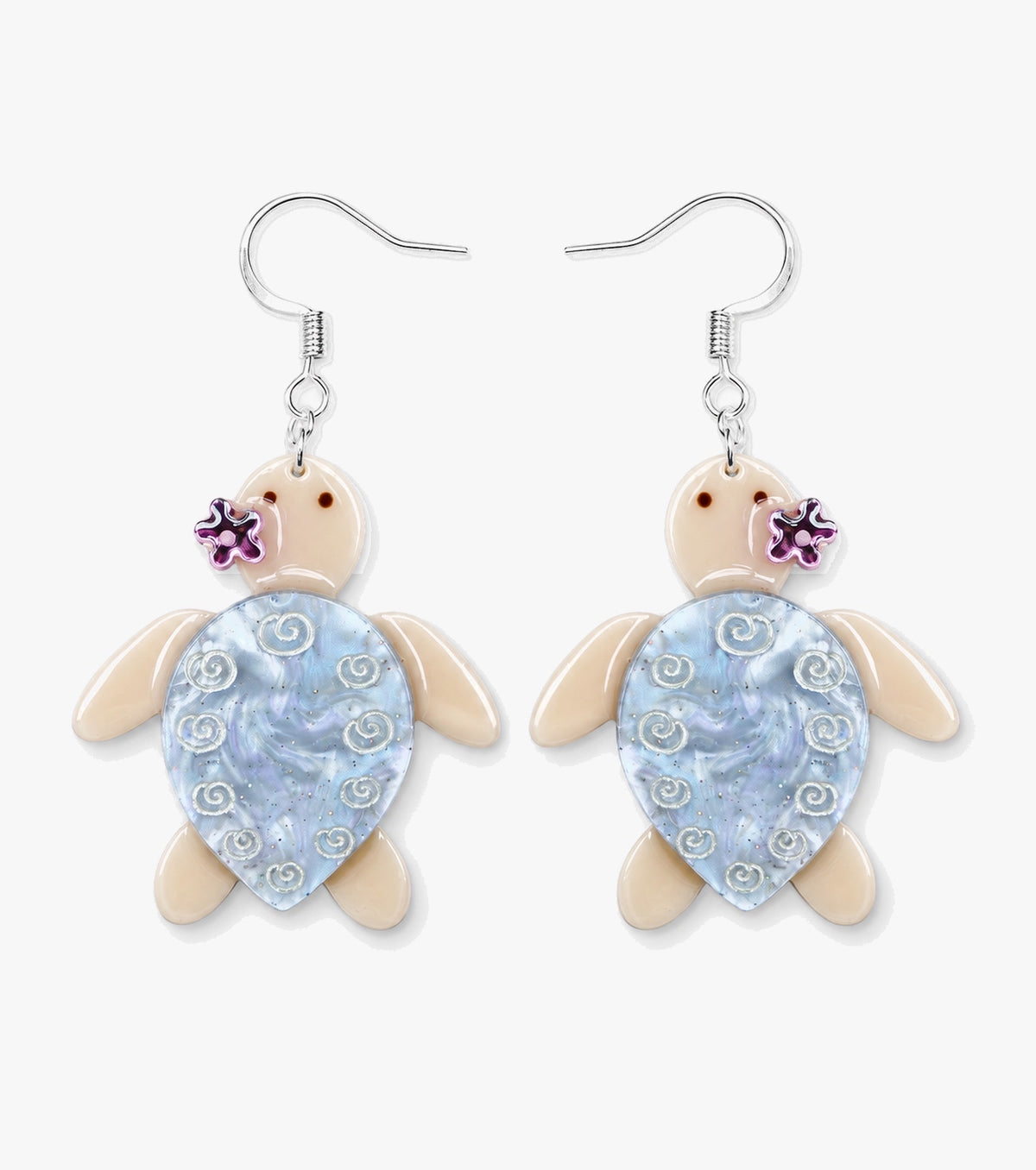 Cream turtle earrings with pale blue pearly shells, white swirl details, and small pink flowers.