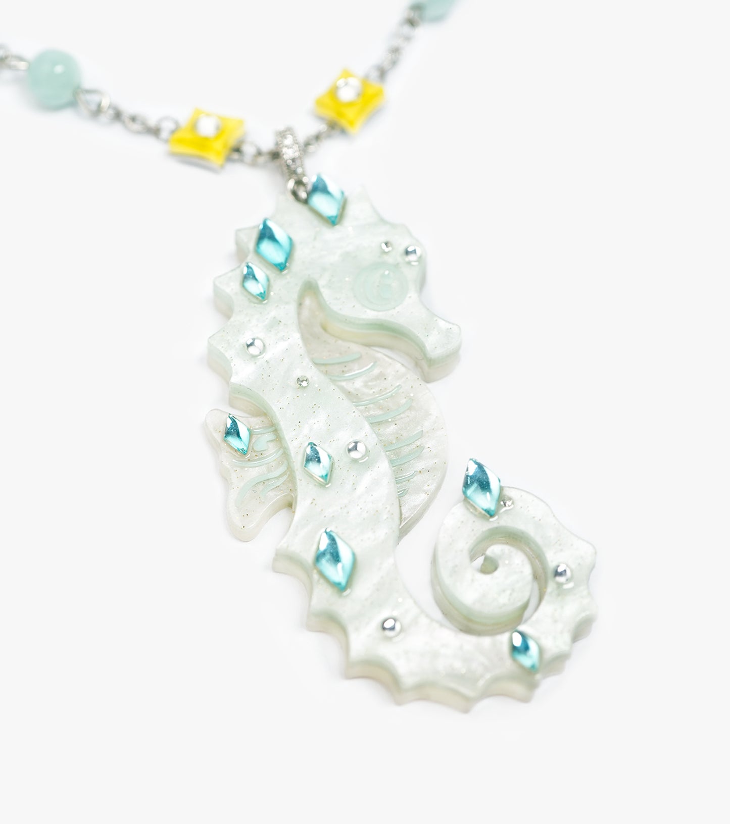 glittering cream seahorse necklace